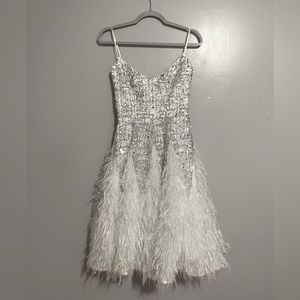 Feathers, sequins sparkly dress